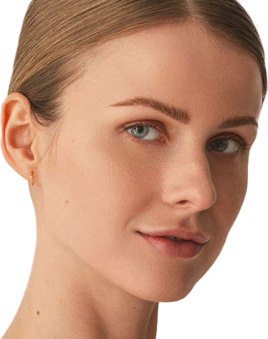 Portrait of a woman looking at the camera, highlighting her natural complexion and smooth skin.